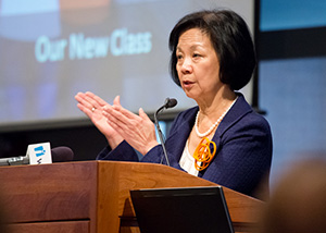 University of Illinois Chancellor Phyllis Wise speaking at a podium